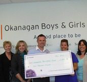 Telus cheque for the Okanagan Boys and Girls Club held by Pihl Law team