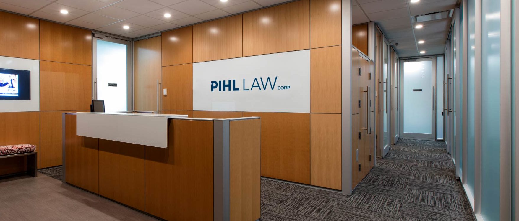 Pihl Law office interior shot with logo sign and reception desk