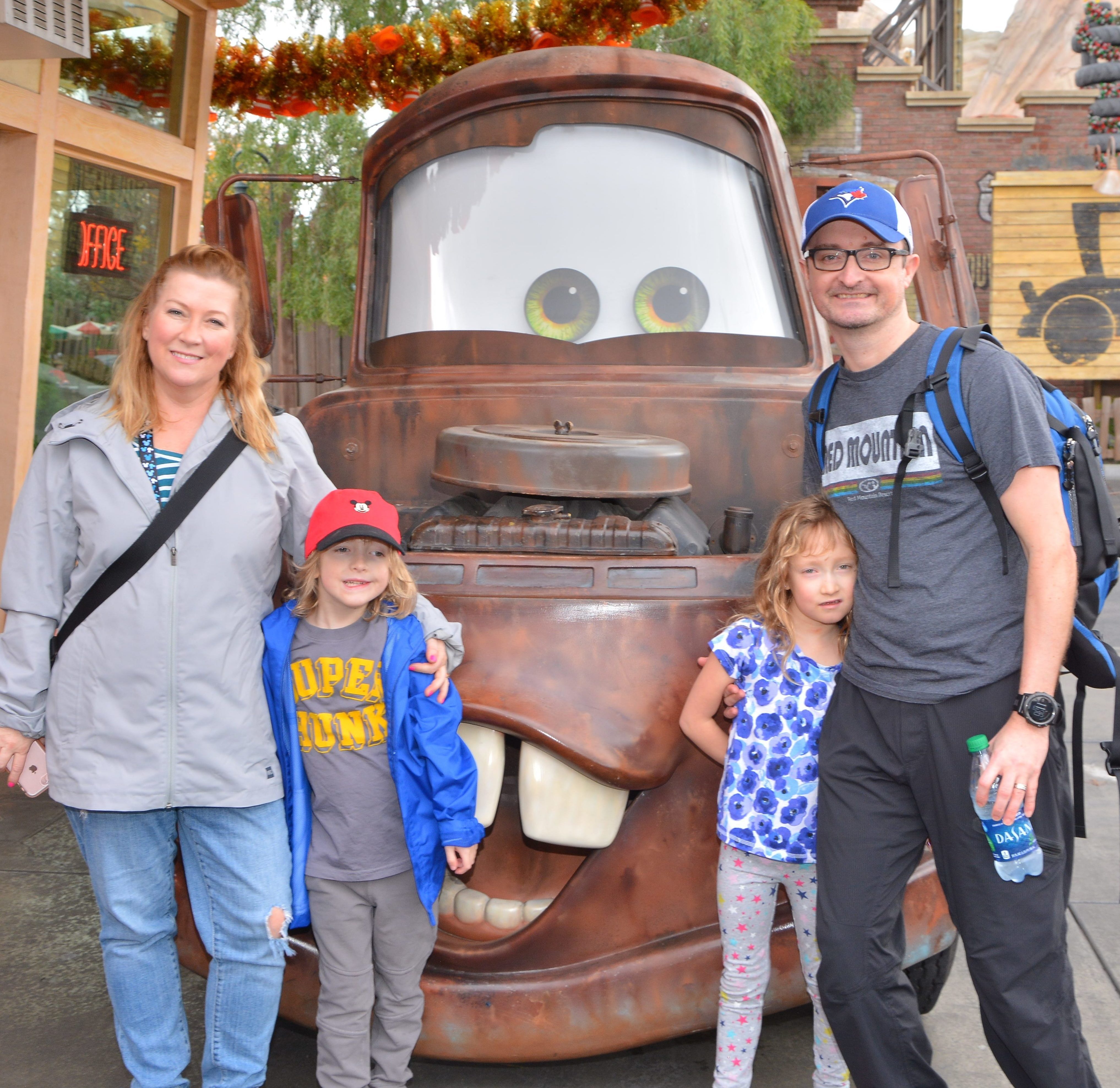 Andrew and Lesley with two children and Cars Movie Tractor