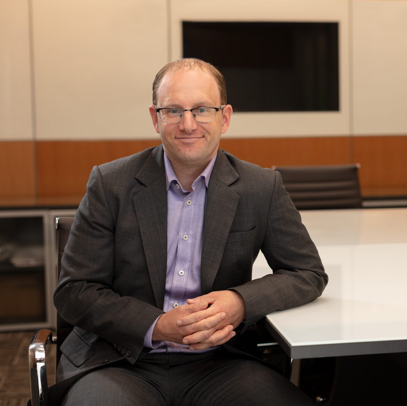 Headshot of Michael Sinclair in Pihl Law boardroom