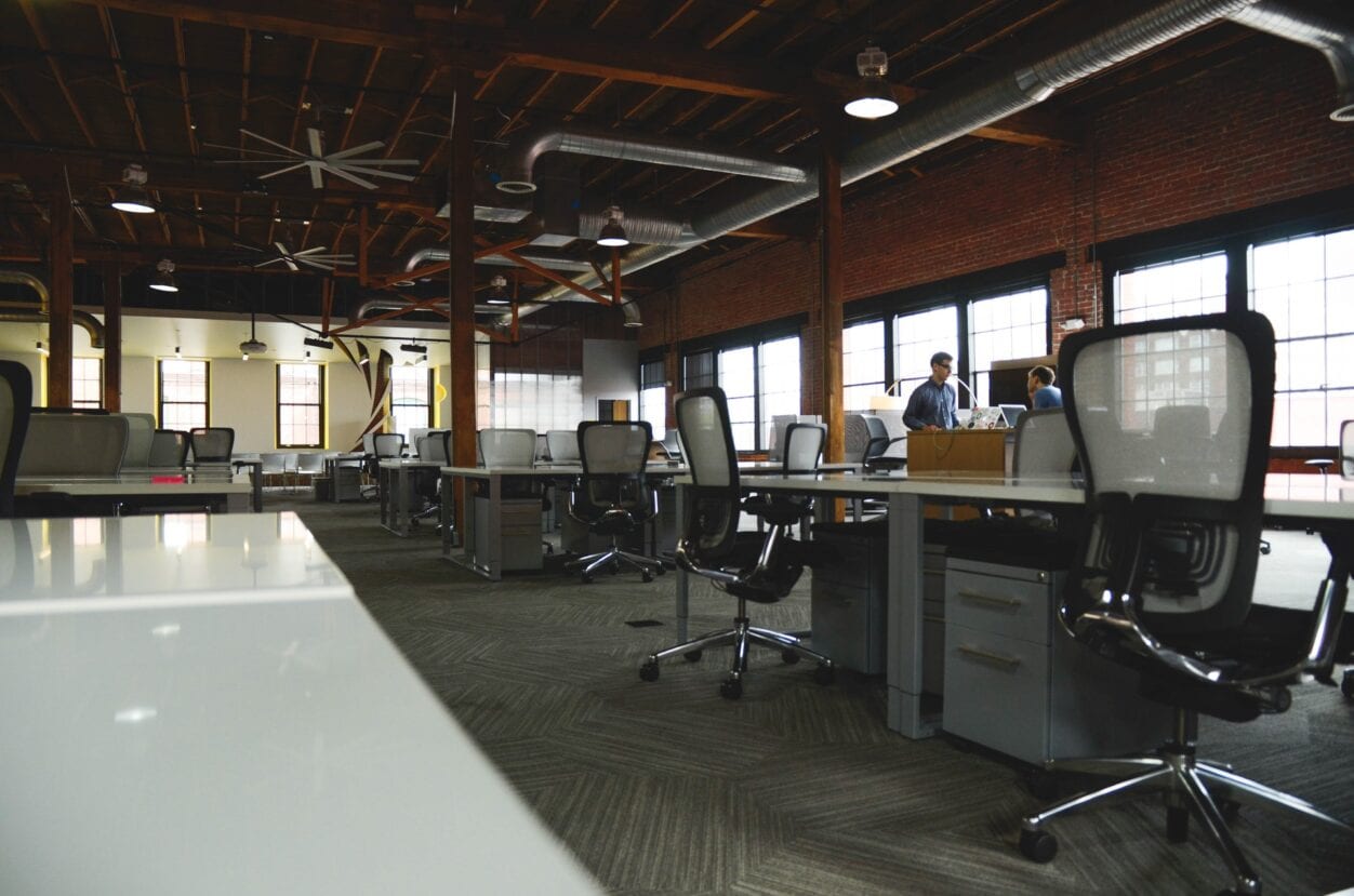 Empty work desks highlighting termination of employment